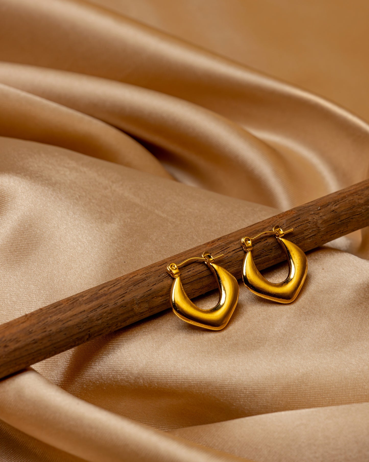 Golden Sculpted Teardrop Hoop Earrings